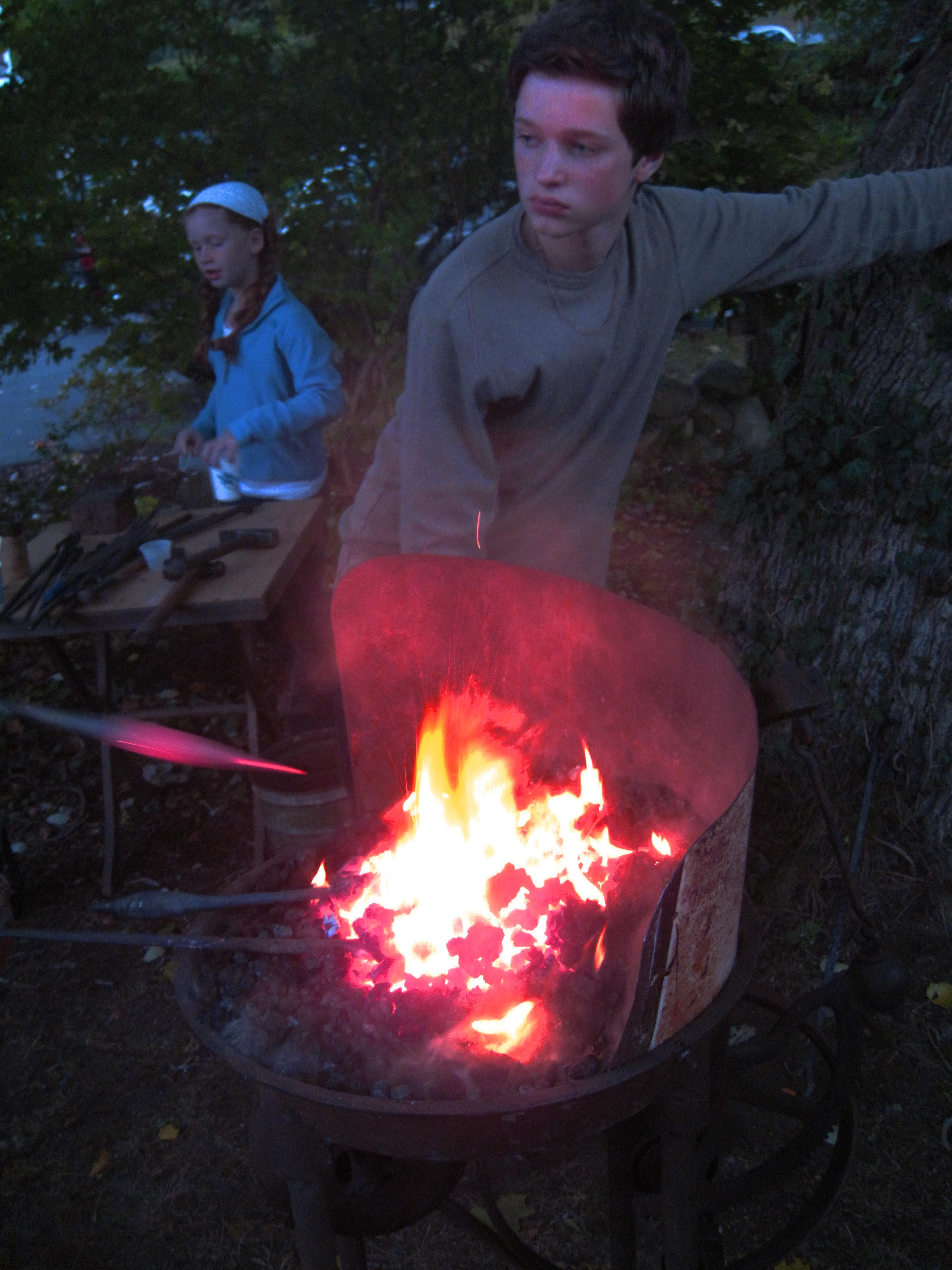 Pumping the Forge Bellows - photo by Richmond Talbot