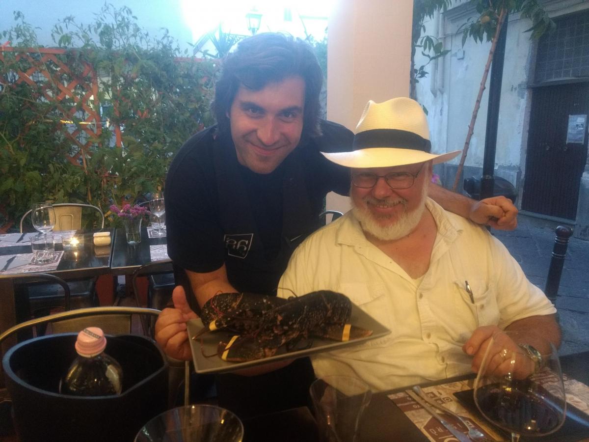 Salvatore of 86 Bistro in Sorrento, with two black European Lobsters